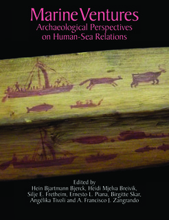 Inuit kayak paddle from Unalakleet, Alaska, decorated with a boat with sails, animals, bird and fish.