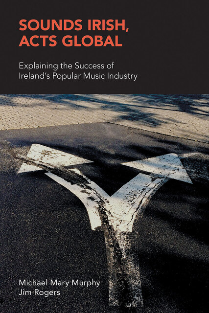 photo depicting a road with the road marking of an arrow which splits in two pointing in opposite directions