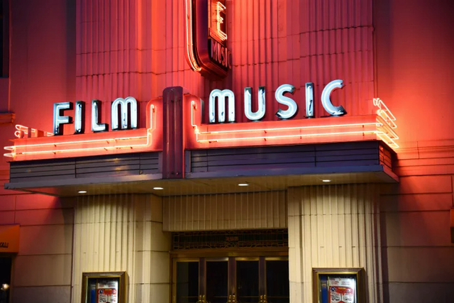 1930s deco sytle cinema with the words Film Music in lights