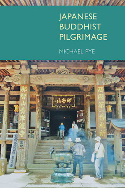 pilgrams/tourists climbing steps to a temple