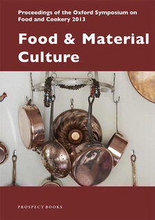 brass pots & pans hanging on a kitchen wall