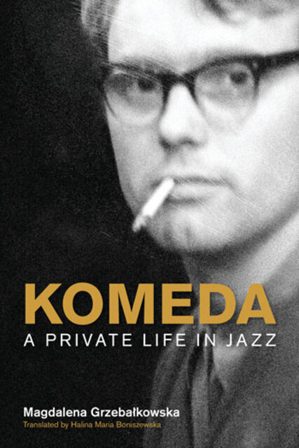 closeup photo of Komeda with a cigarette in his mouth