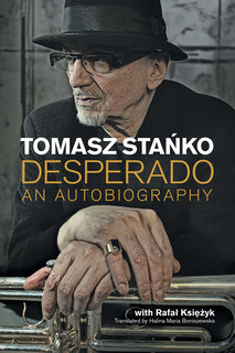 photo of Tomasz Stanko with hands folded on a trumpet