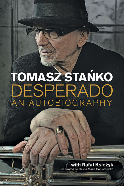 photo of Tomasz Stanko with hands folded on a trumpet
