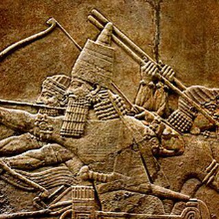 7th-century BC relief depicting Ashurbanipal, r. 669–631 BC, and three royal attendants in a chario