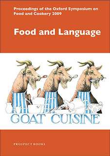 3 goats at a table holding spoons in their mouth wearing aprons with the words goat cuisine underneath