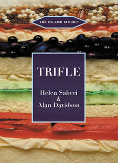 colour photo of a cross section of a trifle with coloured layers and fruit