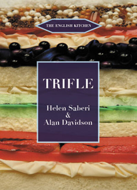 colour photo of a cross section of a trifle with coloured layers and fruit