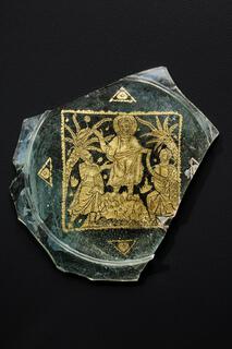 Roman blown glass fragment showing Christ handing a scroll to two figures, possibly Peter & Paul. The scoll readsThe scroll reads “DOMINVS LEGE[M] DAT,” which translates to “the Lord giving the law.” Held at the Toledo Museum of Art. 