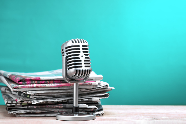 a microphone as at a news desk