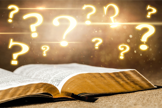 open bible over which hover question marks