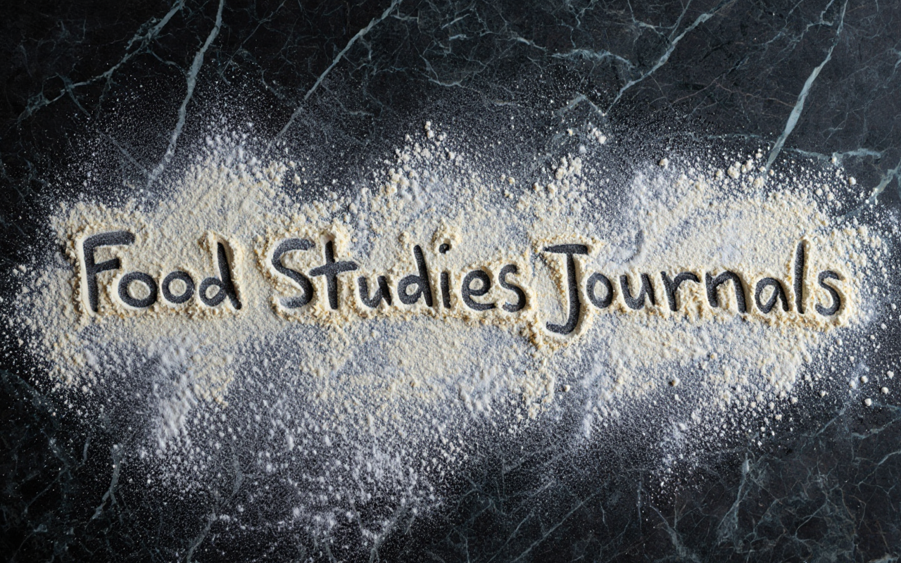 food journals as if written in four on a marble counter top