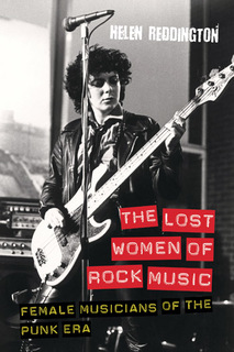 punk female guitarist in recording studio
