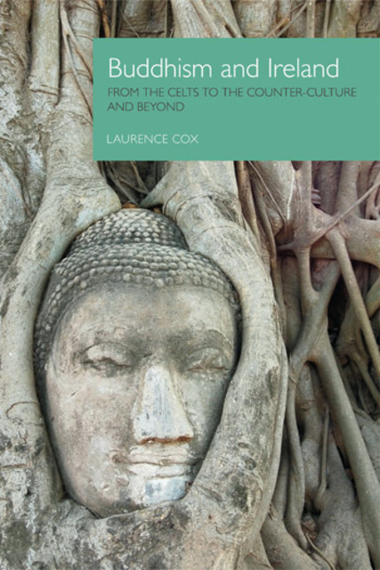 tree roots with carved face of buddha