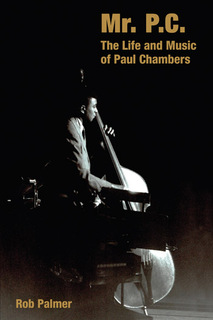 Photo of Chambers playing bass
